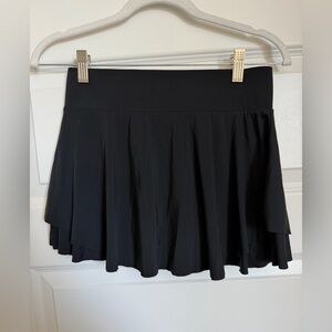 Keiki Kona athletic skirt with built-in shorts and pocket. black, size medium